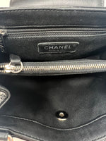 Chanel 
14-
15 Quilted Patent Leather Mini Flap Crossbody