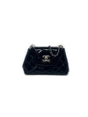 Chanel 
14-
15 Quilted Patent Leather Mini Flap Crossbody