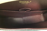 Chanel Black/Gold 
14-
15 Maxi Caviar Double Flap