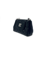 Chanel 
14-
15 Quilted Patent Leather Mini Flap Crossbody