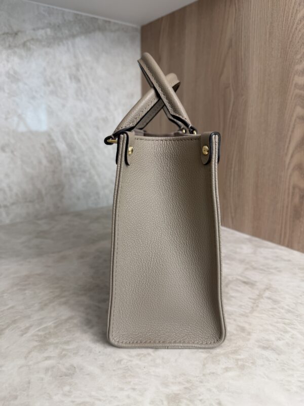 Louis Vuitton Onthego PM Bicolor Monogram Empreinte Leather Dove and Cream