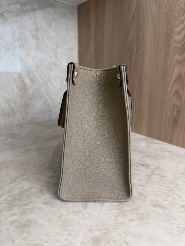 Louis Vuitton Onthego PM Bicolor Monogram Empreinte Leather Dove and Cream